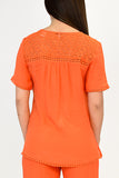 Azucar Ladies Woven Laced Short Sleeved Blouse - orange back on model LRPB154